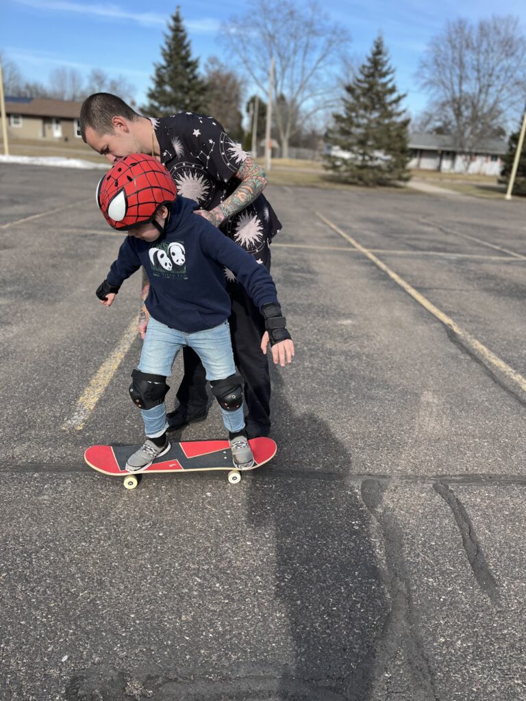 Chris teaching Trent to skate